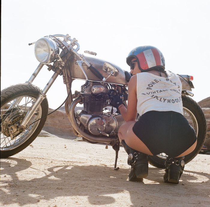 A playful frame from Girls on a motorcycle — online in Shanghai